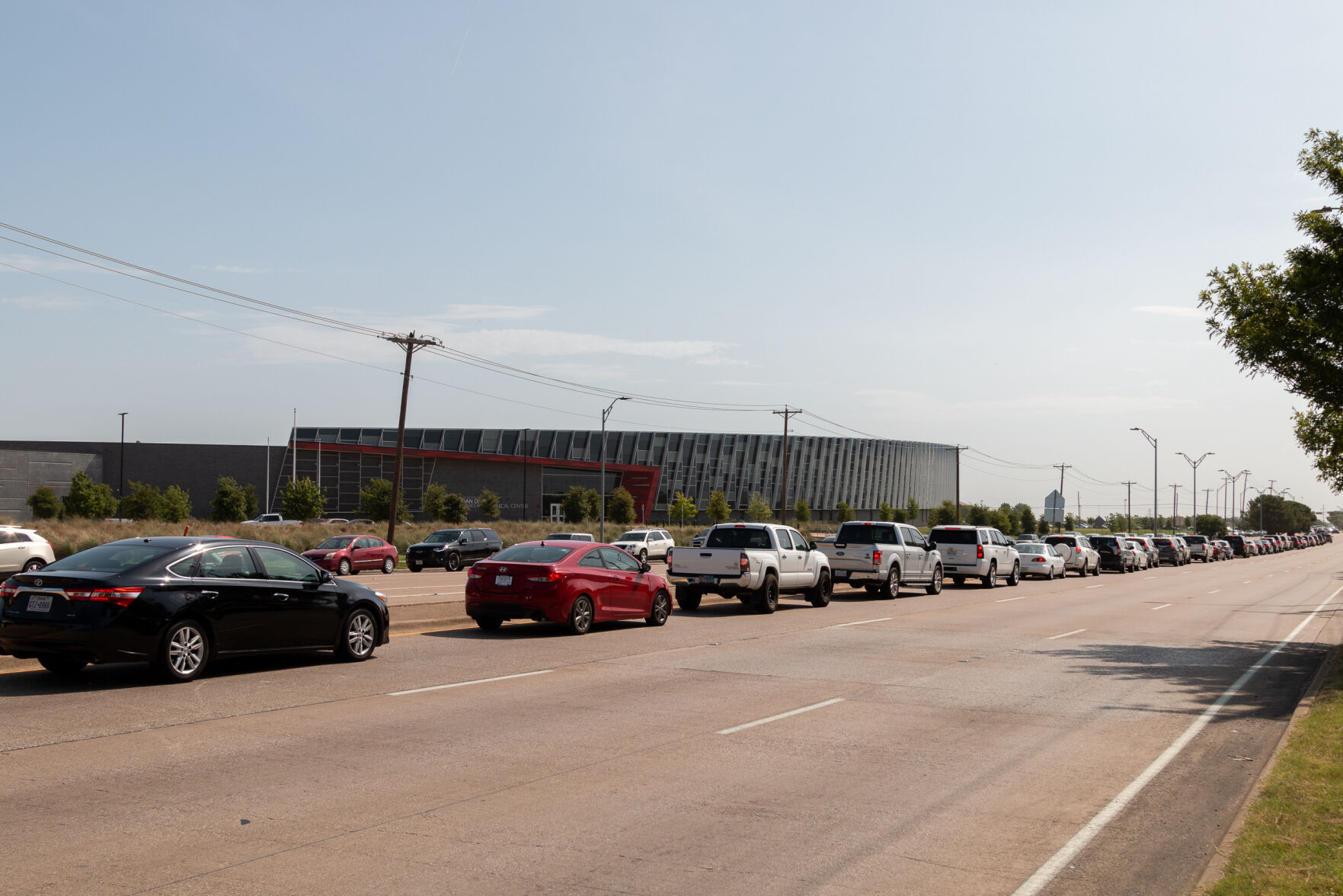 Photos: Cars line up for over three miles at Arlington face mask distribution